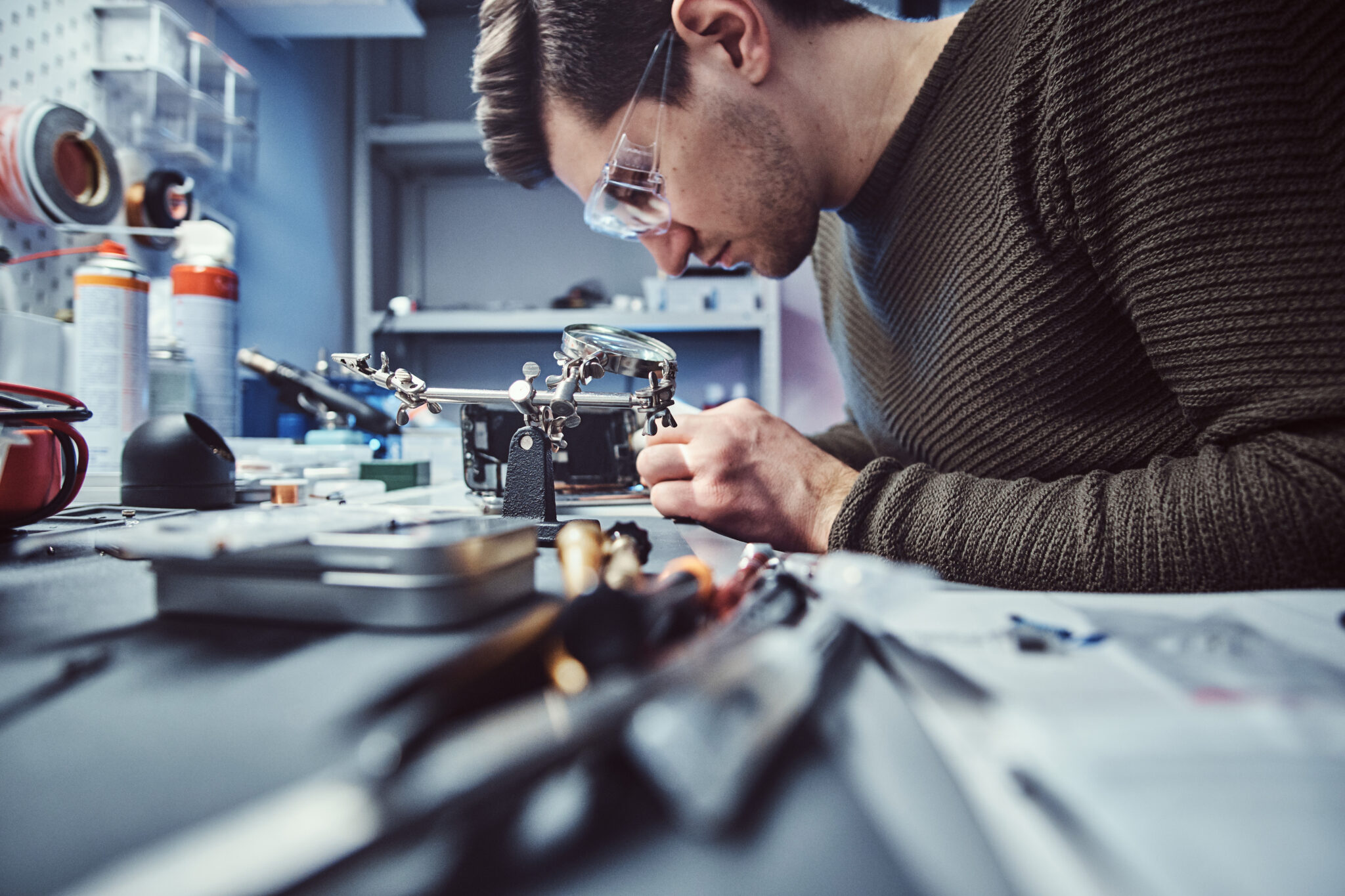 Electronic technician working in the repair shop